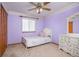 Bedroom features a full-sized bed, large closet and natural light at 18899 E Whitaker Cir, Aurora, CO 80015