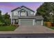 Charming two-story home with a well-maintained lawn, mature trees and a three-car garage at 18899 E Whitaker Cir, Aurora, CO 80015