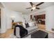 Open-concept living room connected to the kitchen, featuring modern decor and a ceiling fan at 18899 E Whitaker Cir, Aurora, CO 80015
