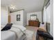 Main bedroom features vaulted ceiling, dresser and window at 18899 E Whitaker Cir, Aurora, CO 80015