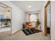 Cozy sitting room features a chair with ottoman and modern decor at 18899 E Whitaker Cir, Aurora, CO 80015