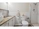 Clean bathroom with granite countertop, shower, and toilet at 605 S Alton Way # 9C, Denver, CO 80247