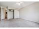 Spacious bedroom with double-door closet and ceiling fan at 605 S Alton Way # 9C, Denver, CO 80247
