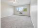 Bright bedroom with window, ceiling fan, and neutral carpet at 605 S Alton Way # 9C, Denver, CO 80247