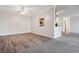 Dining room with kitchen pass-through and wood-look flooring at 605 S Alton Way # 9C, Denver, CO 80247