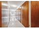 Long hallway with multiple storage unit doors at 605 S Alton Way # 9C, Denver, CO 80247