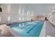 Indoor lap pool with clean lines and plenty of natural light at 605 S Alton Way # 9C, Denver, CO 80247