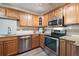 Modern kitchen with stainless steel appliances and granite countertops at 605 S Alton Way # 9C, Denver, CO 80247