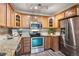 Updated kitchen with stainless steel appliances and granite countertops at 605 S Alton Way # 9C, Denver, CO 80247