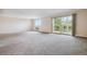 Bright living room featuring a balcony and ample space at 605 S Alton Way # 9C, Denver, CO 80247