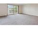 Open living area showcasing sliding glass doors to a balcony at 605 S Alton Way # 9C, Denver, CO 80247