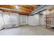 Basement storage area with shelves, utilities, and a window at 15800 E 121St Ave # L1, Brighton, CO 80603