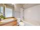 Bathroom with vanity, sink, toilet, and tub shower combination at 15800 E 121St Ave # L1, Brighton, CO 80603