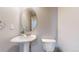 Pedestal sink and toilet in a clean and well-maintained half bathroom at 15800 E 121St Ave # L1, Brighton, CO 80603