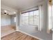 Spacious bedroom featuring a large window with blinds and a view to the outside at 15800 E 121St Ave # L1, Brighton, CO 80603