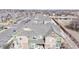 Townhome featuring a neutral color palette, a gray roof, and well-manicured landscaping at 15800 E 121St Ave # L1, Brighton, CO 80603