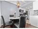 A dining area features a round marble table with seating for four under a pendant light at 200 N Pearl St # 106, Denver, CO 80203