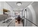 The kitchen showcases stainless appliances with a view of an adjacent dining area at 200 N Pearl St # 106, Denver, CO 80203