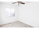 Simple bedroom with ceiling fan and window at 16091 E Geddes Dr # 74, Aurora, CO 80016