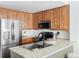 Modern kitchen with stainless steel appliances and light wood cabinets at 16091 E Geddes Dr # 74, Aurora, CO 80016