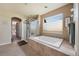 Bathroom features a large soaking tub and separate shower at 9928 Bluestar Dr, Parker, CO 80138
