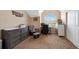 Tranquil bedroom with vaulted ceiling, comfortable furnishings, and a large arched window at 9928 Bluestar Dr, Parker, CO 80138