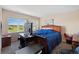 Cozy bedroom with large window with views of open space at 9928 Bluestar Dr, Parker, CO 80138
