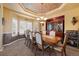 Elegant dining room featuring custom ceiling details, ample natural light and space for entertaining at 9928 Bluestar Dr, Parker, CO 80138