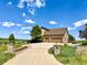 Long private driveway leading to a well-maintained home with a three-car garage and scenic surroundings at 9928 Bluestar Dr, Parker, CO 80138