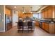 Charming kitchen features an island with seating, stainless steel appliances, and lovely countertops at 9928 Bluestar Dr, Parker, CO 80138