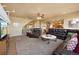 Spacious living room with leather furniture, open floor plan, and a cozy atmosphere at 9928 Bluestar Dr, Parker, CO 80138
