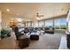Spacious living room with large windows, comfortable seating, and scenic views at 9928 Bluestar Dr, Parker, CO 80138