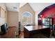 Home office with ample natural light and a large desk at 9928 Bluestar Dr, Parker, CO 80138