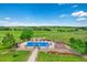Inviting pool area featuring a well-maintained pool, lounge chairs, and a picturesque countryside backdrop at 9928 Bluestar Dr, Parker, CO 80138