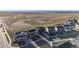Aerial view shows well-kept homes, green spaces, and proximity to open fields at 6211 Bauer Dr, Frederick, CO 80504