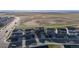 An aerial view of homes with solar panels on the roofs and open space at 6211 Bauer Dr, Frederick, CO 80504