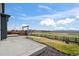 A beautifully landscaped backyard features a concrete patio and mountain views at 6211 Bauer Dr, Frederick, CO 80504