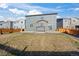 The home has a backyard with an open pergola and sliding glass doors at 6211 Bauer Dr, Frederick, CO 80504