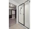 A walk-in shower features a glass enclosure and is located next to a large walk-in closet at 6211 Bauer Dr, Frederick, CO 80504