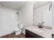 A full bathroom features a shower-tub, granite countertops, and a dark wood vanity at 6211 Bauer Dr, Frederick, CO 80504