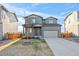 Charming two-story home features a well-maintained lawn and a spacious two-car garage at 6211 Bauer Dr, Frederick, CO 80504