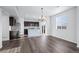Open floor plan featuring a kitchen with stainless steel appliances and a stylish island at 6211 Bauer Dr, Frederick, CO 80504
