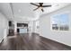 Open-concept living area with abundant natural light and modern luxury vinyl plank flooring at 6211 Bauer Dr, Frederick, CO 80504