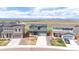 Modern homes in a suburban neighborhood each featuring manicured lawns and mountain views at 6211 Bauer Dr, Frederick, CO 80504