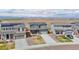 New homes in suburban neighborhood each featuring modern exteriors and mountain views at 6211 Bauer Dr, Frederick, CO 80504