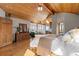 Bright bedroom with vaulted wood ceilings, dresser, and windows providing stunning natural outdoor views at 30717 Conifer Mountain Dr, Conifer, CO 80433
