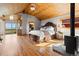 Spacious bedroom featuring hardwood floors, a wood ceiling, and access to a deck with scenic views at 30717 Conifer Mountain Dr, Conifer, CO 80433