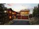 Charming home with stone accents and a two-car garage, set in a beautiful mountain landscape at 30717 Conifer Mountain Dr, Conifer, CO 80433