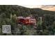 Beautiful mountain home with ample deck space and scenic views, with a QR code overlay at 30717 Conifer Mountain Dr, Conifer, CO 80433