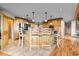 A kitchen island with barstool seating is the focal point of this kitchen at 30717 Conifer Mountain Dr, Conifer, CO 80433